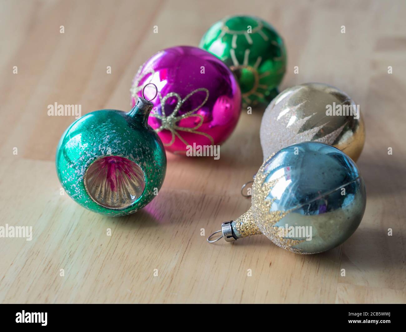 old retro christmas decoration collection with colorful glass christmas  baubles on wooden table Stock Photo - Alamy