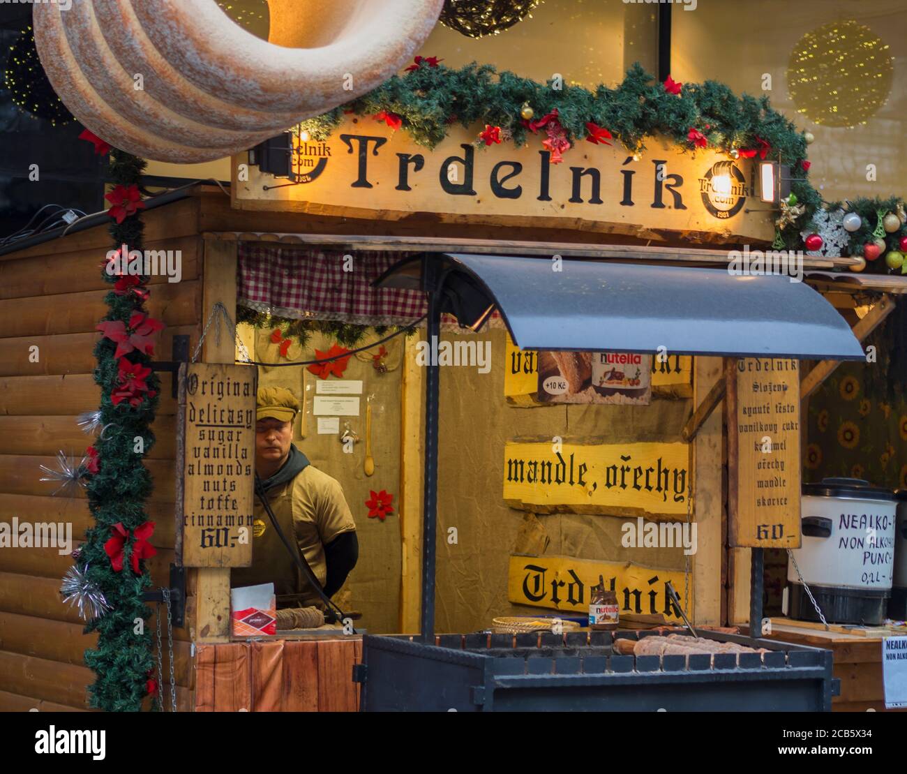 Czech republic, Prague, old town, December 6, 2017: decorated christmas market stand with traditional sweet candy trdelnik original delicasy in old Stock Photo