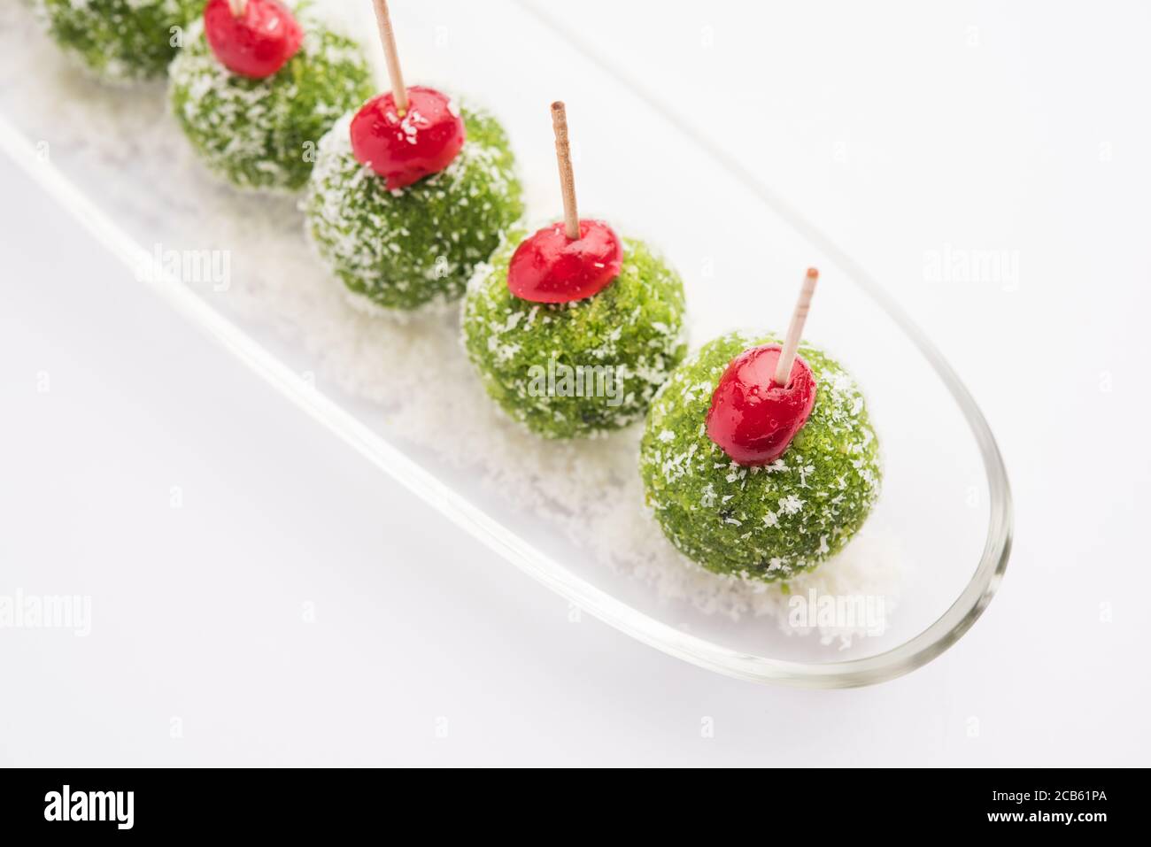 Paan Coconut Laddu or Ladoo - Betel Leaves mixed with Nariyal and sugar to make sweet Balls having Pan Flavour Stock Photo