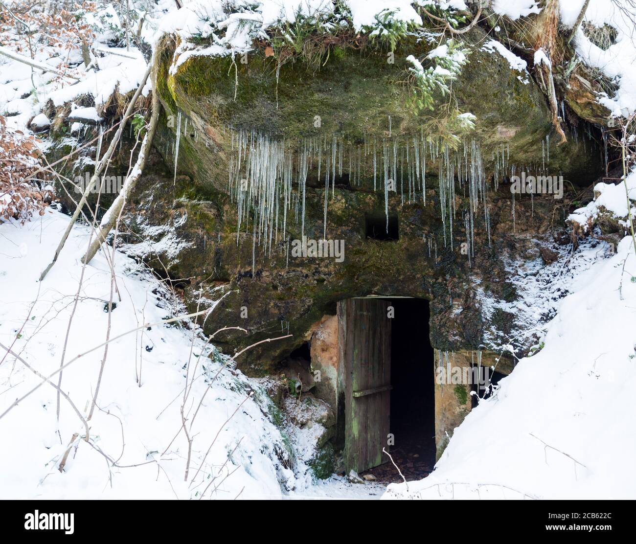 Open Dark Cellar Door In Sandstone Rock Cave With Moss And Lichens And Long Hanging Icicles White Snow Background Stock Photo Alamy Open Dark Cellar Door In Sandstone Rock Cave With Moss And Lichens And Long Hanging Icicles White Snow Background Stock Photo Alamy