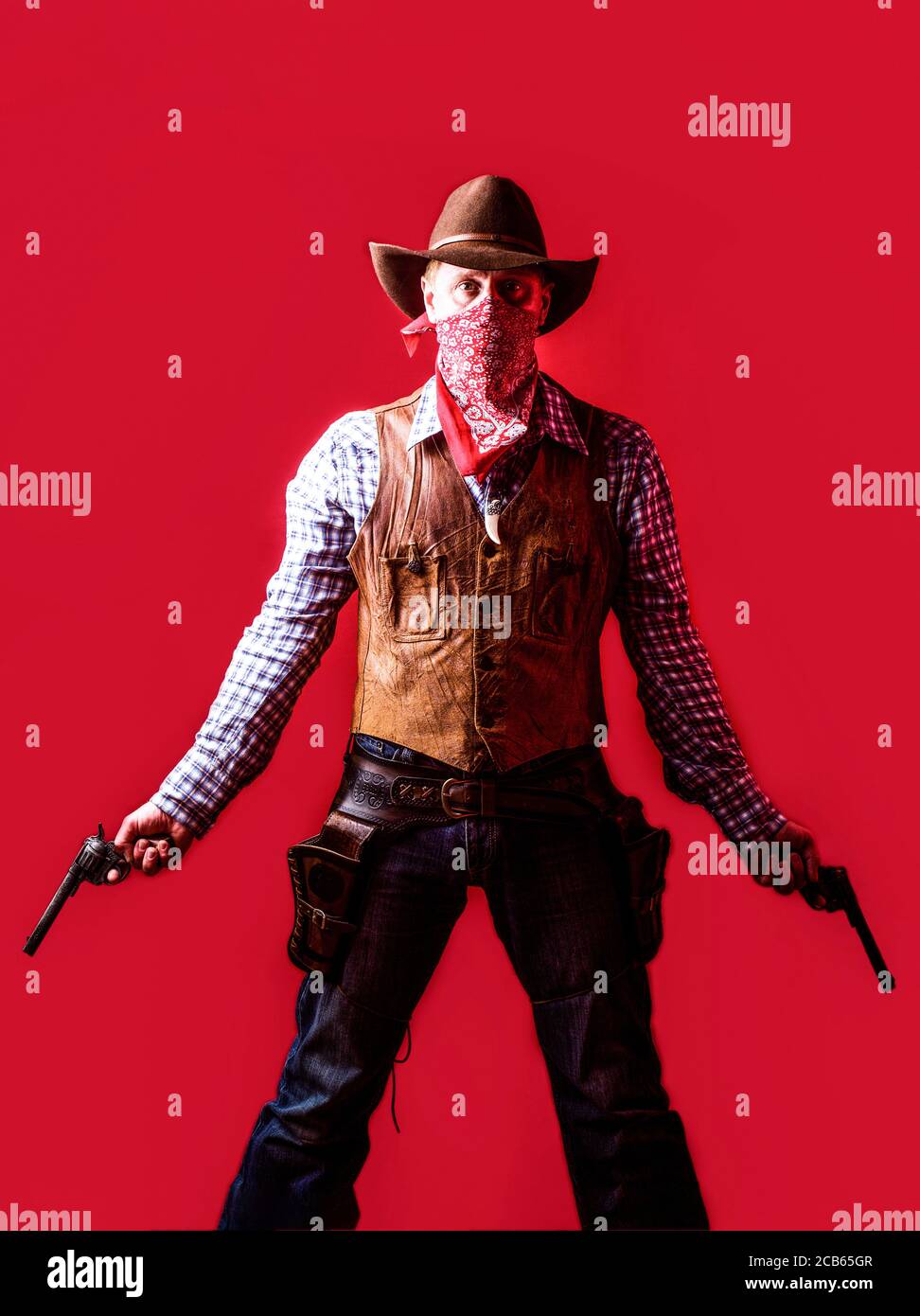 American bandit in mask, western man with hat. Man wearing cowboy hat, gun.  West, guns. Portrait of a cowboy. owboy with weapon on red background Stock  Photo - Alamy