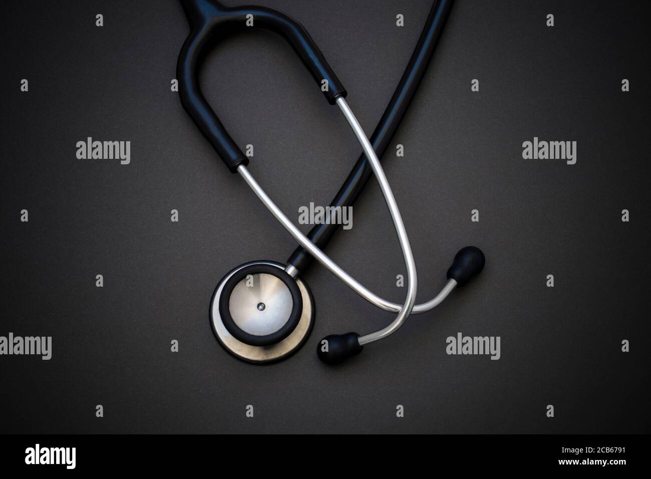 Stethoscope on black background. Cardiology concept. World health day