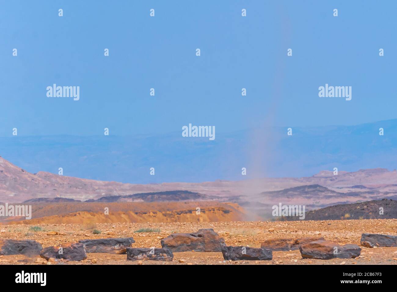 Whirlwind forms a dust pillar in the desert. Photographed in the Negev Desert, Israel Stock Photo