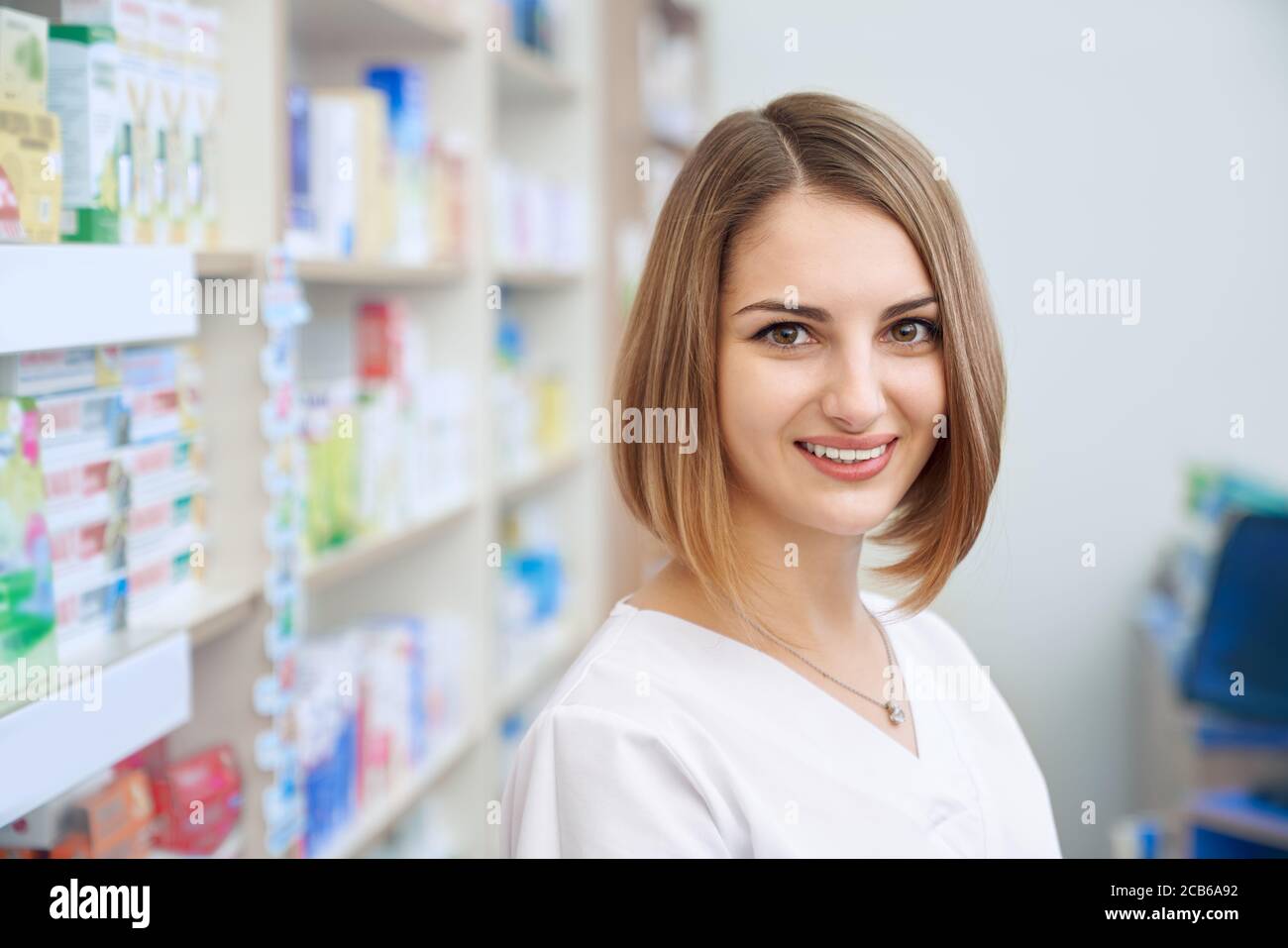 Smiling pharmacist standing in drug hi-res stock photography and images ...