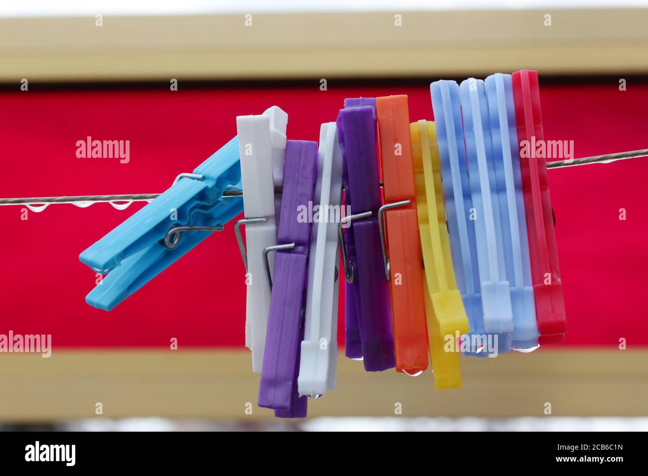 Colored Clothes Pins Clothes Line Rope Stock Photo Alamy