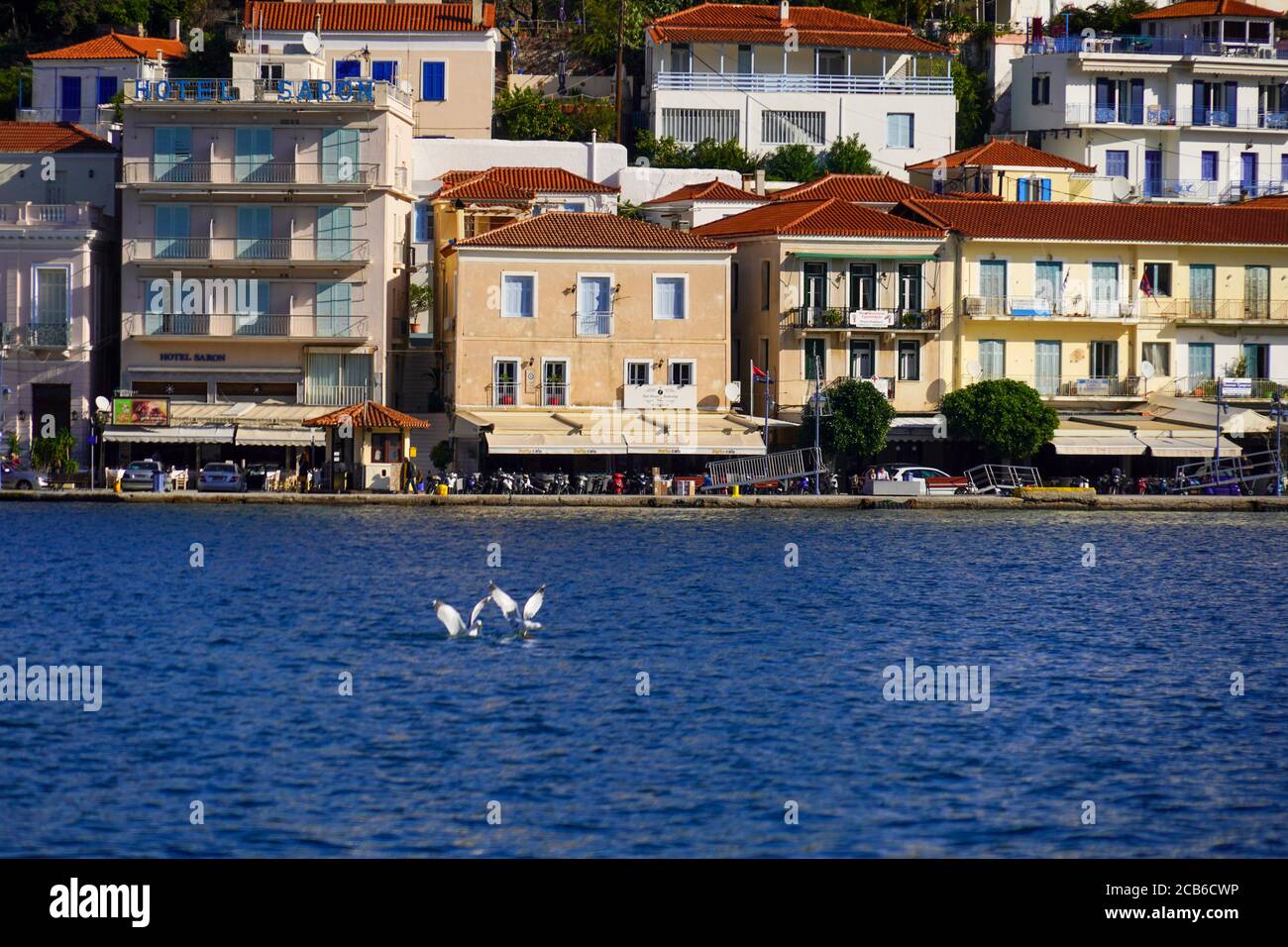 the harbour at Poros is a small Greek island-pair in the southern part of the Saronic Gulf, Greece Stock Photo