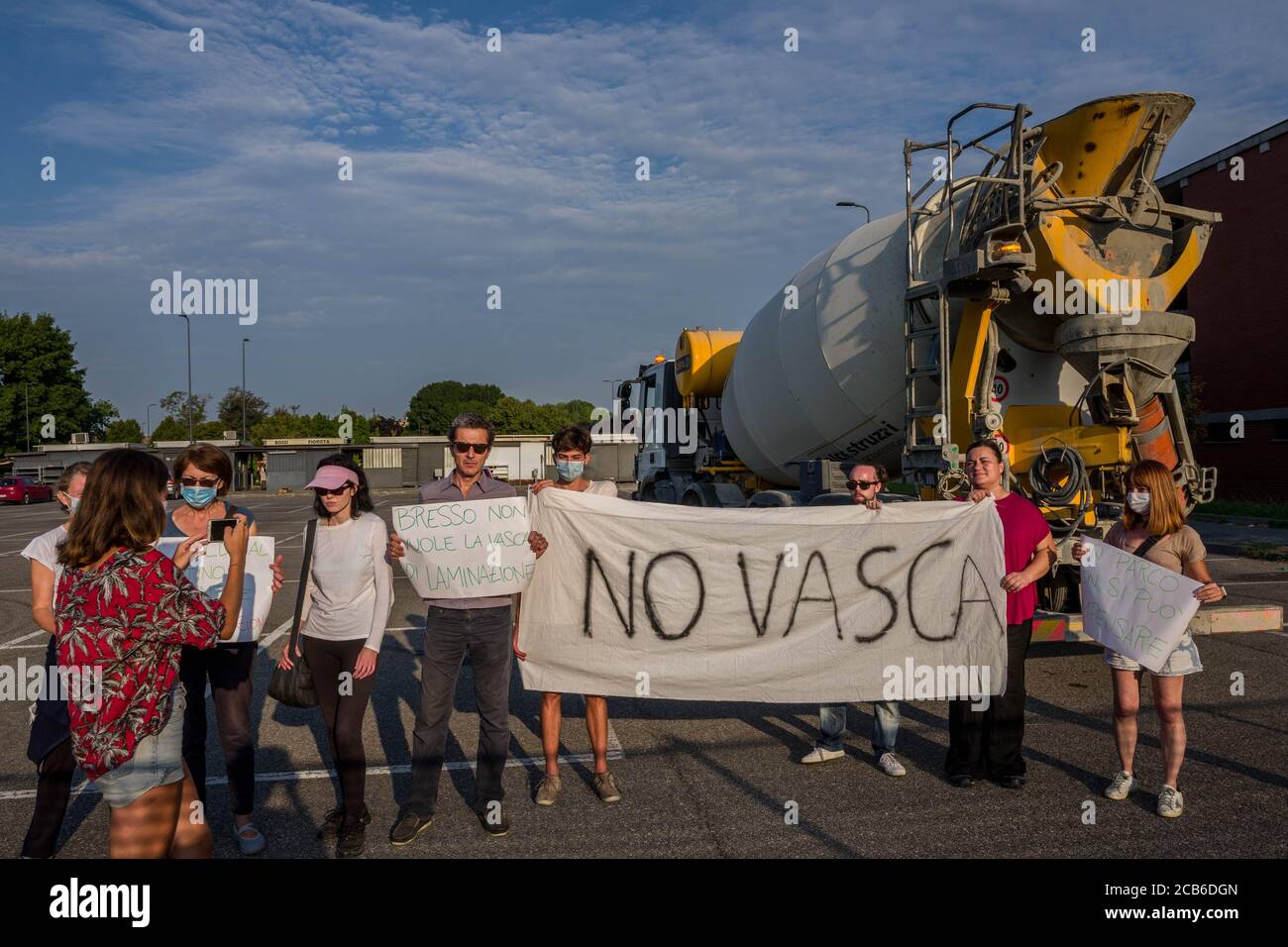 Milan, Italy. 11th Aug, 2020. Milan. Activists committed to safeguarding  Parco Nord and Seveso block a concrete mixer in a construction site at the  Bruzzano cemetery. Later identified and evacuated by the