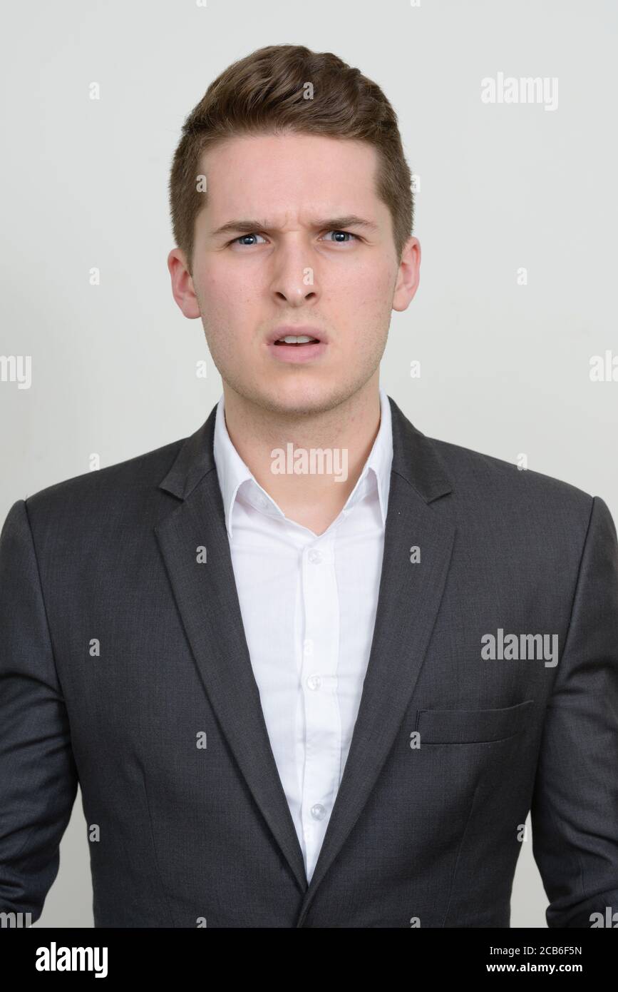 Portrait of young handsome businessman in suit Stock Photo - Alamy