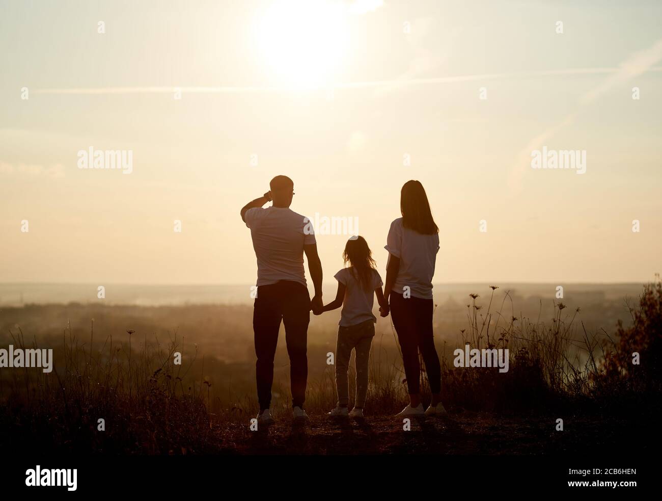 pic Silhouette Beautiful Mother And Daughter Drawing https www alamy com silhouette of a family father mother and daughter standing on the hill with their backs to the camera and looking to the horizon on the sunset image368324397 html