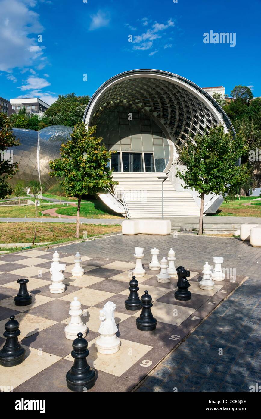 Giant chess game in front of the Concert Hall and Exhibition Centre, Rike Park, Tbilisi, Georgia, Caucasus, Middle East, Asia Stock Photo