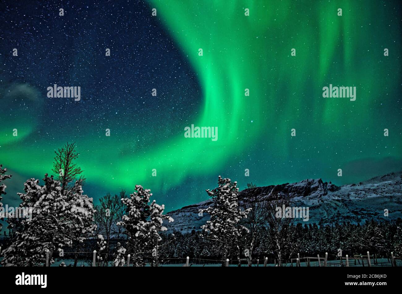 Northern Lights // Polar Lights // Tromso // Norway // Troms og Finnmark // Snow // Mountains // Arctic // Winter // Stars Stock Photo