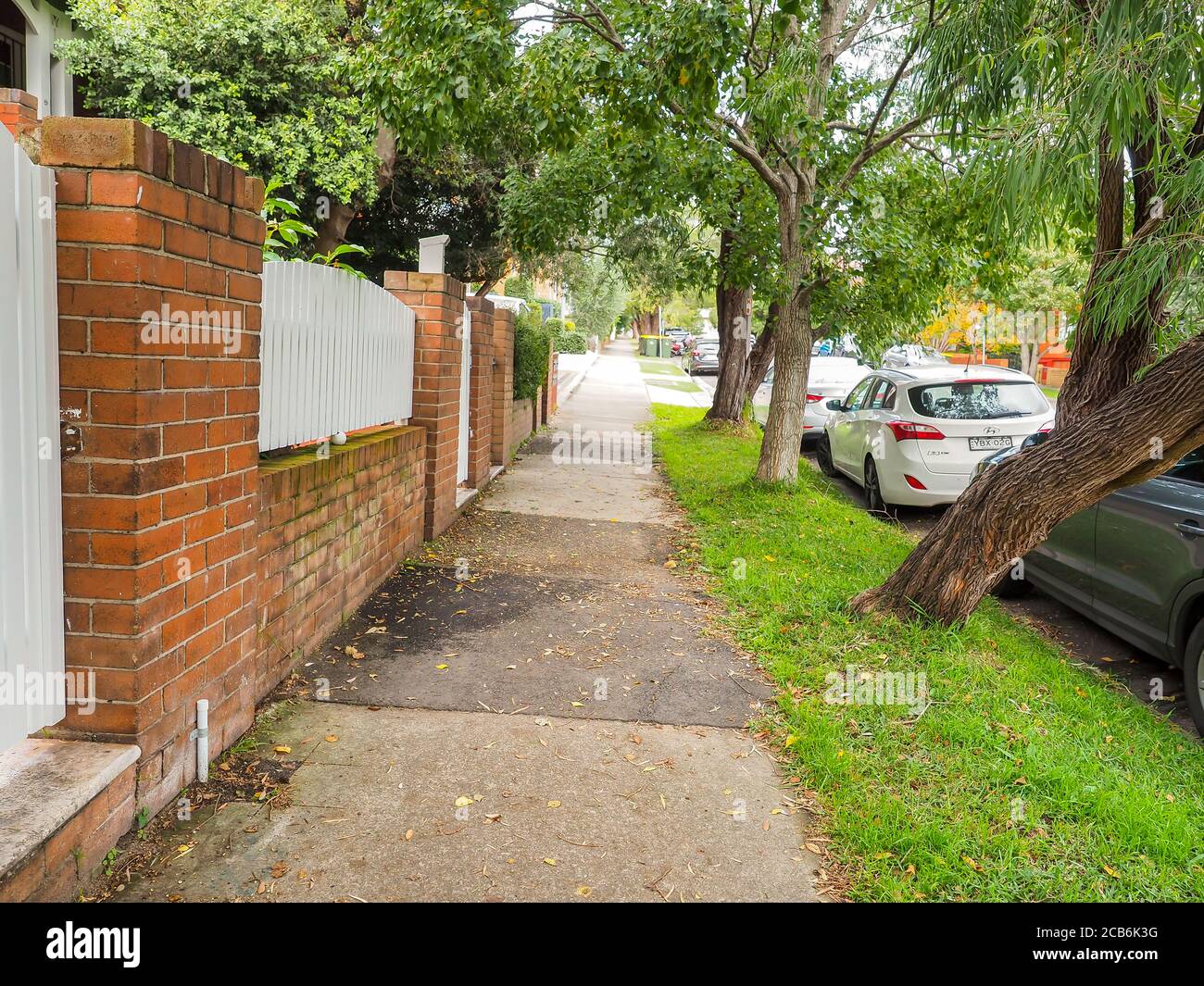 Footpath in a residential area of Randwick on a cloudy autumn afternoon Stock Photo