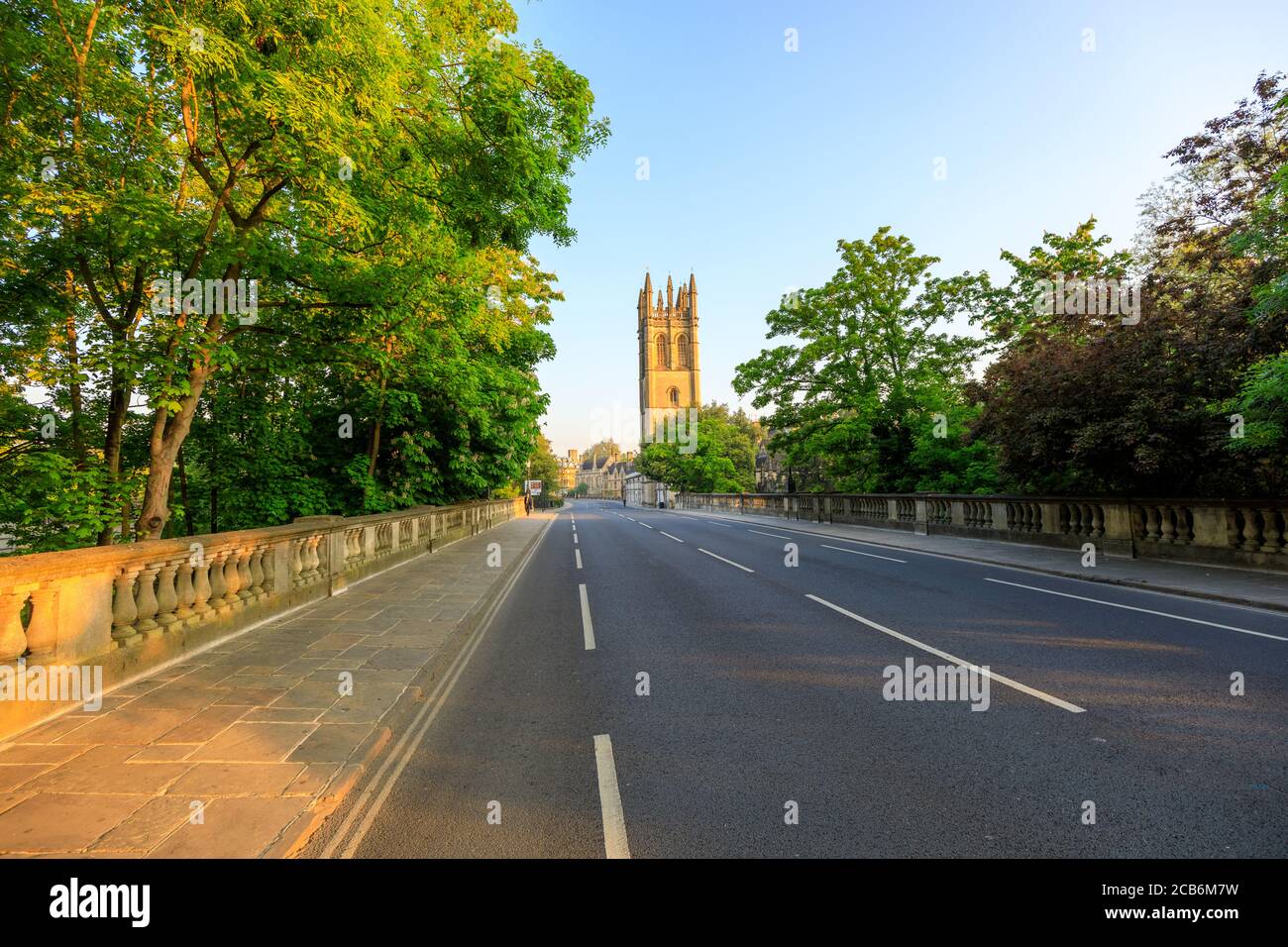 Magdalen Bridge and Magdalen Tower in Oxford at sunrise with no people around, early in the morning on a clear day with blue sky. Oxford, England, UK. Stock Photo