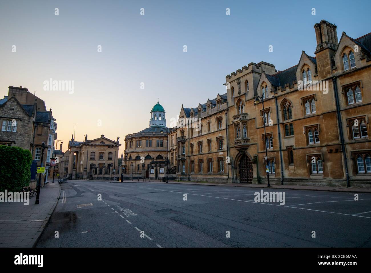 The Clarendon Building, The Sheldonian Theatre and Exeter College lining Broad Street in Oxford with no people or vehicles. Early in the morning. Stock Photo