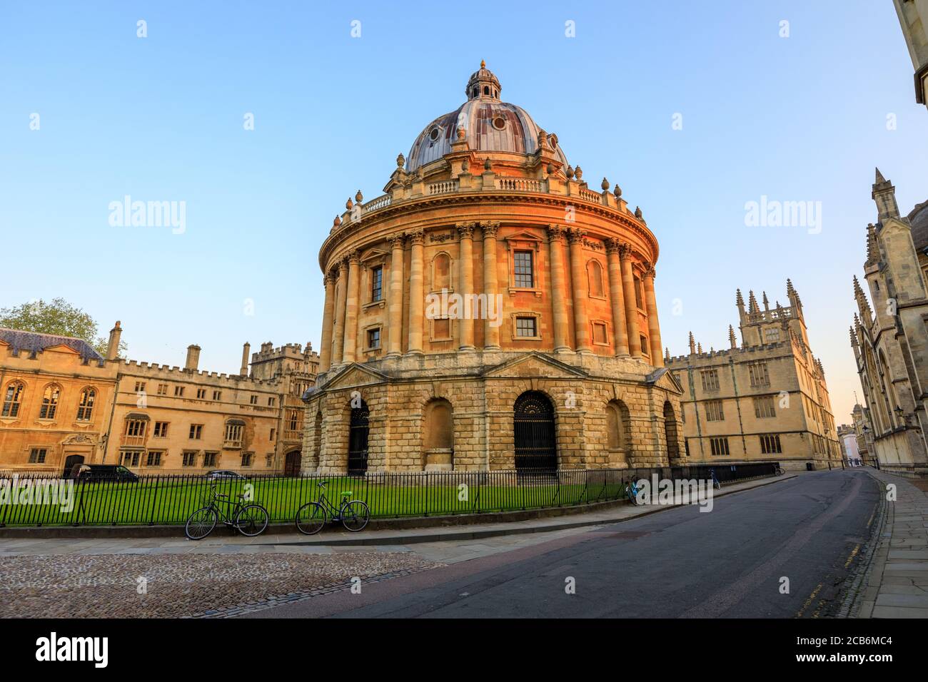 The Radcliffe Camera in Oxford at sunrise with no people around, early in the morning on a clear day with blue sky. Oxford, England, UK. Stock Photo