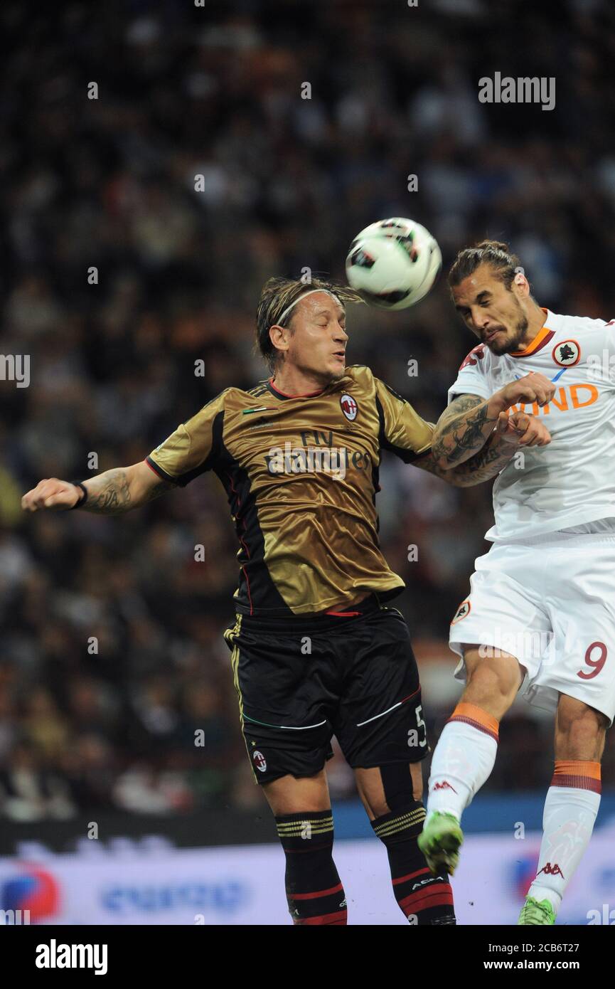 Milan  Italy  12 May 2013, 'G.MEAZZA SAN SIRO ' Stadium,Football championship Seria A 2012/2013, AC Milan - AS Roma : Philippe Mexes and Pablo Osvaldo in action during the match Stock Photo