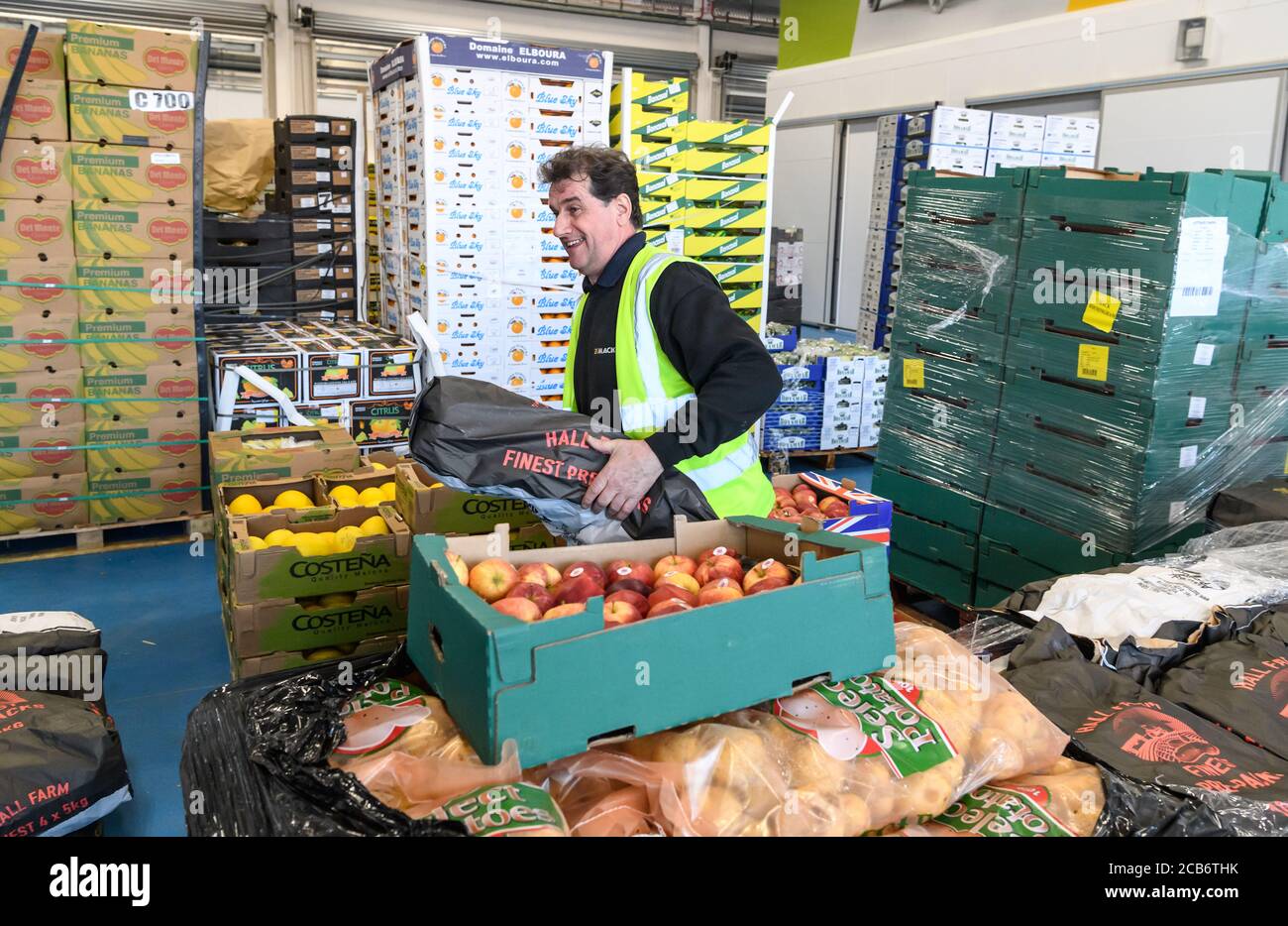 Staff and customers at the Birmingham Wholesale Market. The largest integrated market in the UK providing fruit and vegetable, fish, poultry, meat and flower trading operations on one site. The current premises opened in May 2018. Stock Photo