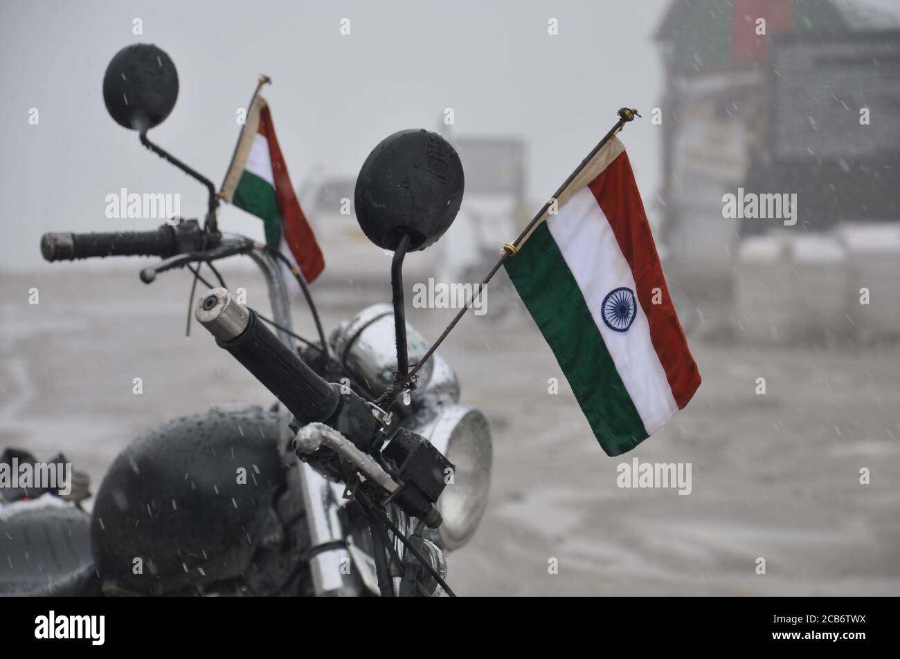 Indian flags on a motorcycle handle bar in the Himalayas Stock Photo