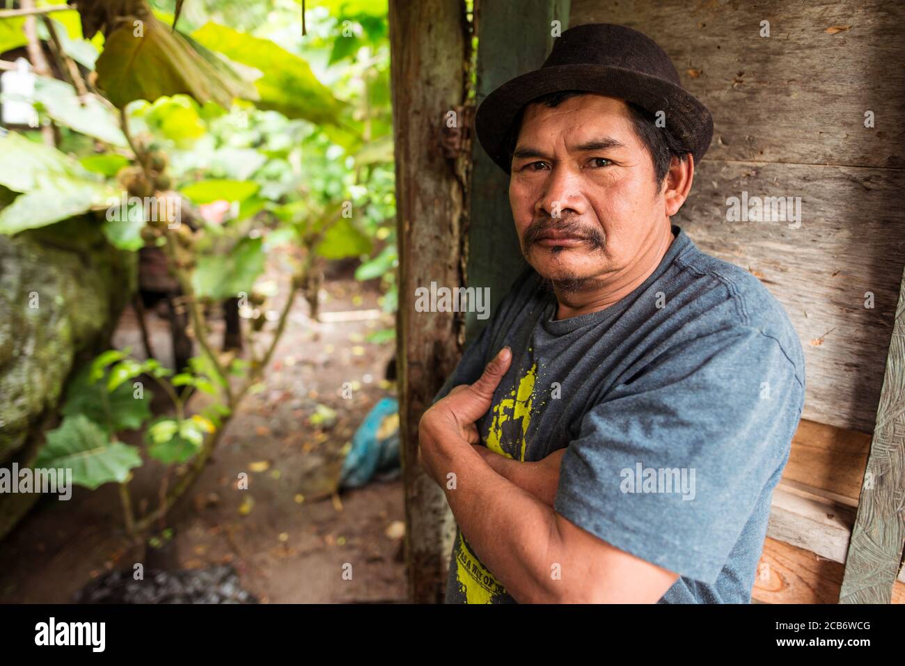 Boquete / Panama - June 15, 2019: portrait of panamanian farmer man with hat at farm gate Stock Photo