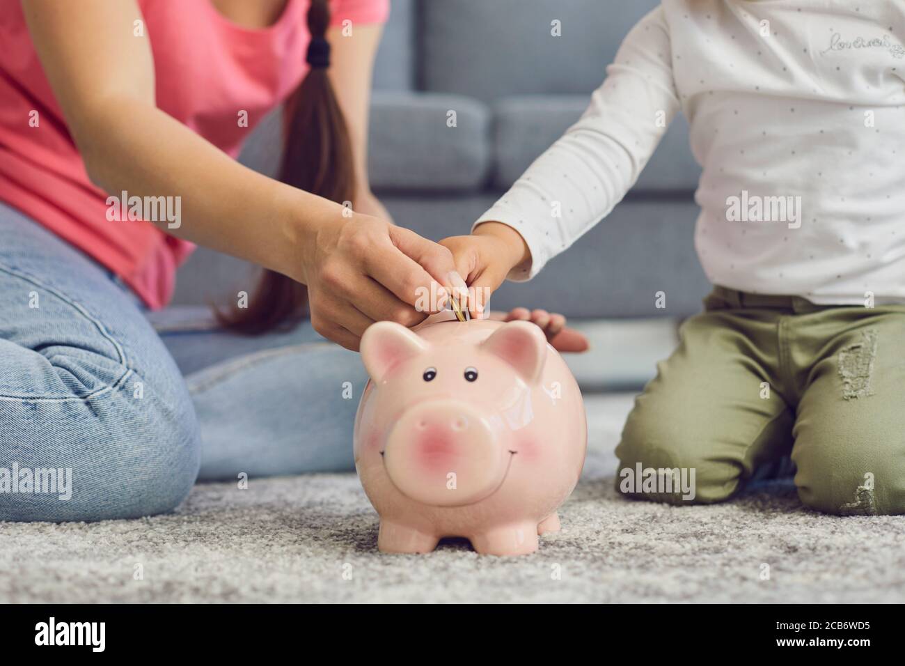 Mom and daughter saving money hi-res stock photography and images - Alamy