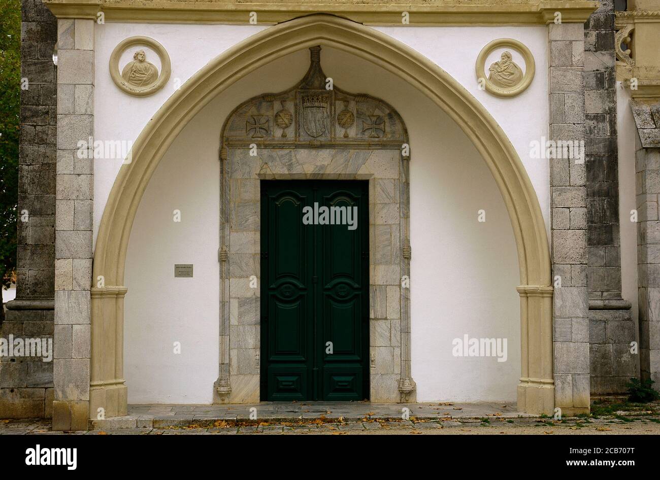 Portugal, Alentejo region, Beja. Convent of Our Lady of the Conception (Convento de Nossa Senhora da Conceiçao), a congregation of Poor Clares. It was founded in 1495. Today Museum Rainha Dona Leonor. Entrance door of porch with an ogee arch. Stock Photo
