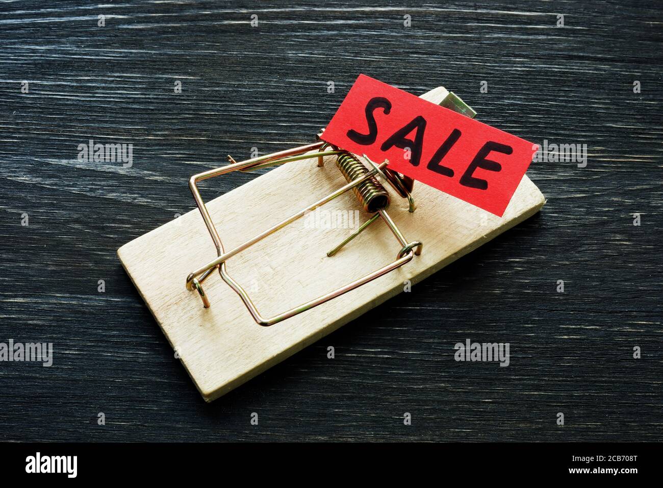 Scam or sale fraud concept. Mousetrap with inscription. Stock Photo