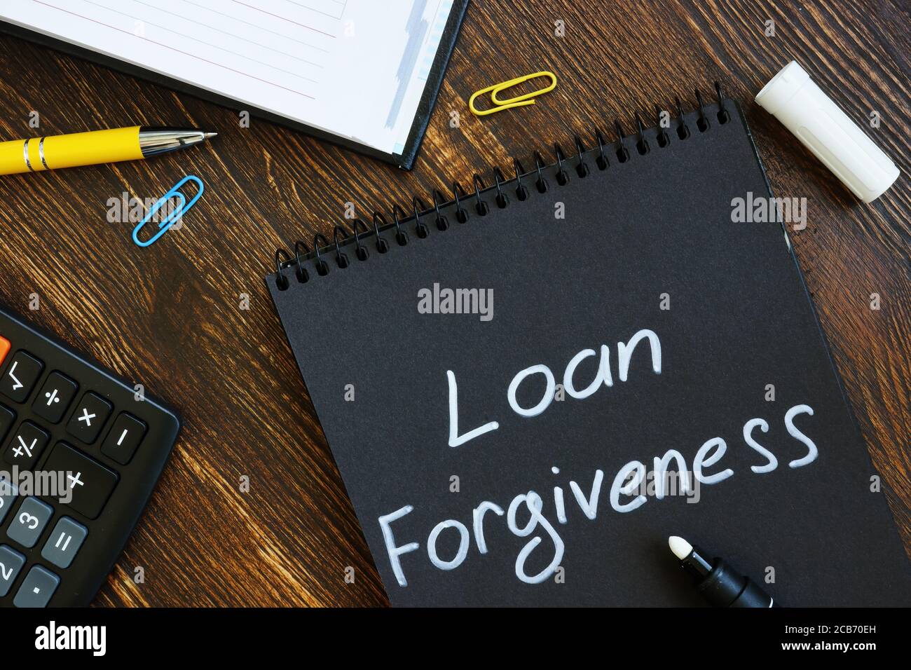 Loan forgiveness note on notepad page. Stock Photo