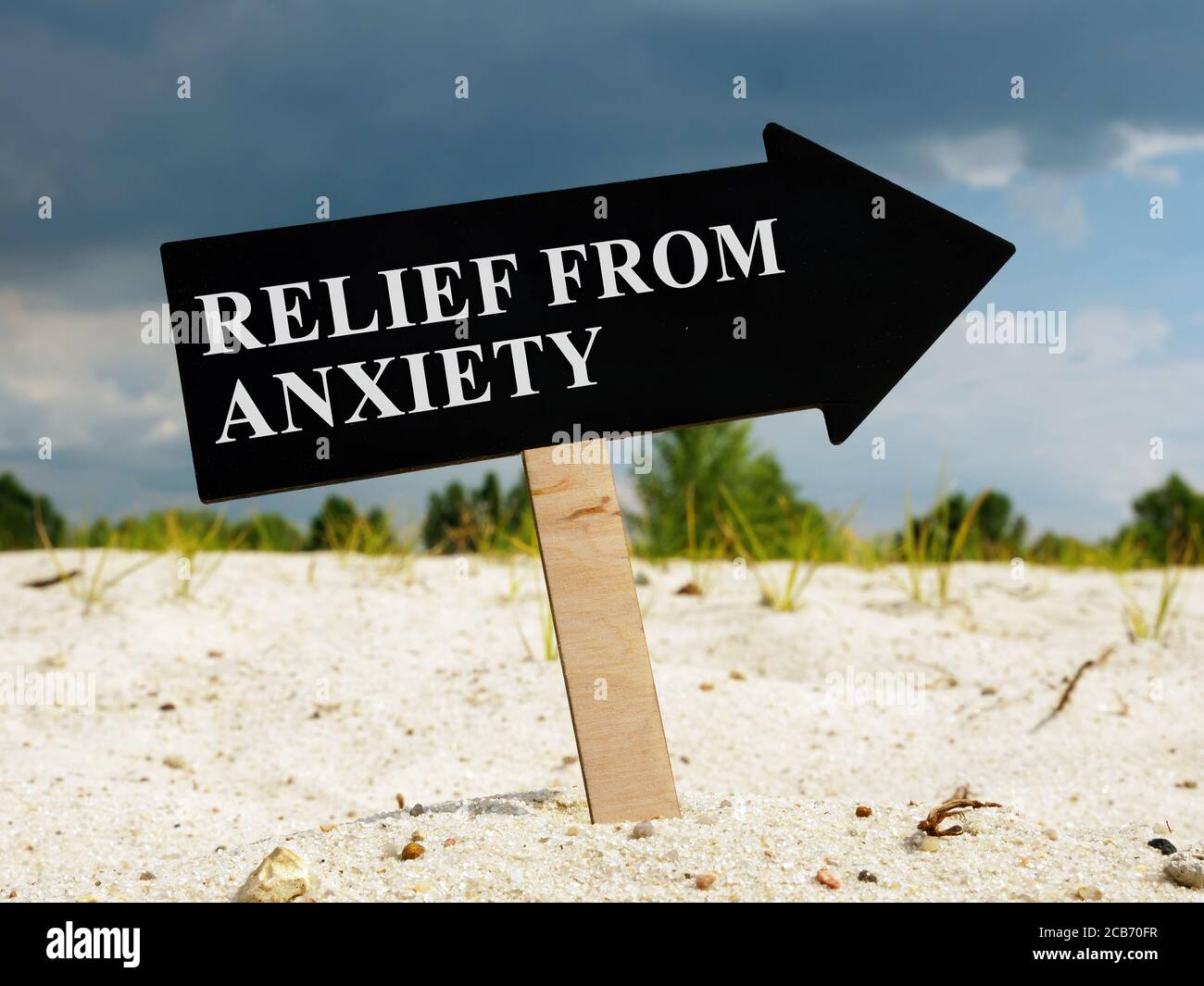 Arrow with words Relief from anxiety in a desert. Stock Photo