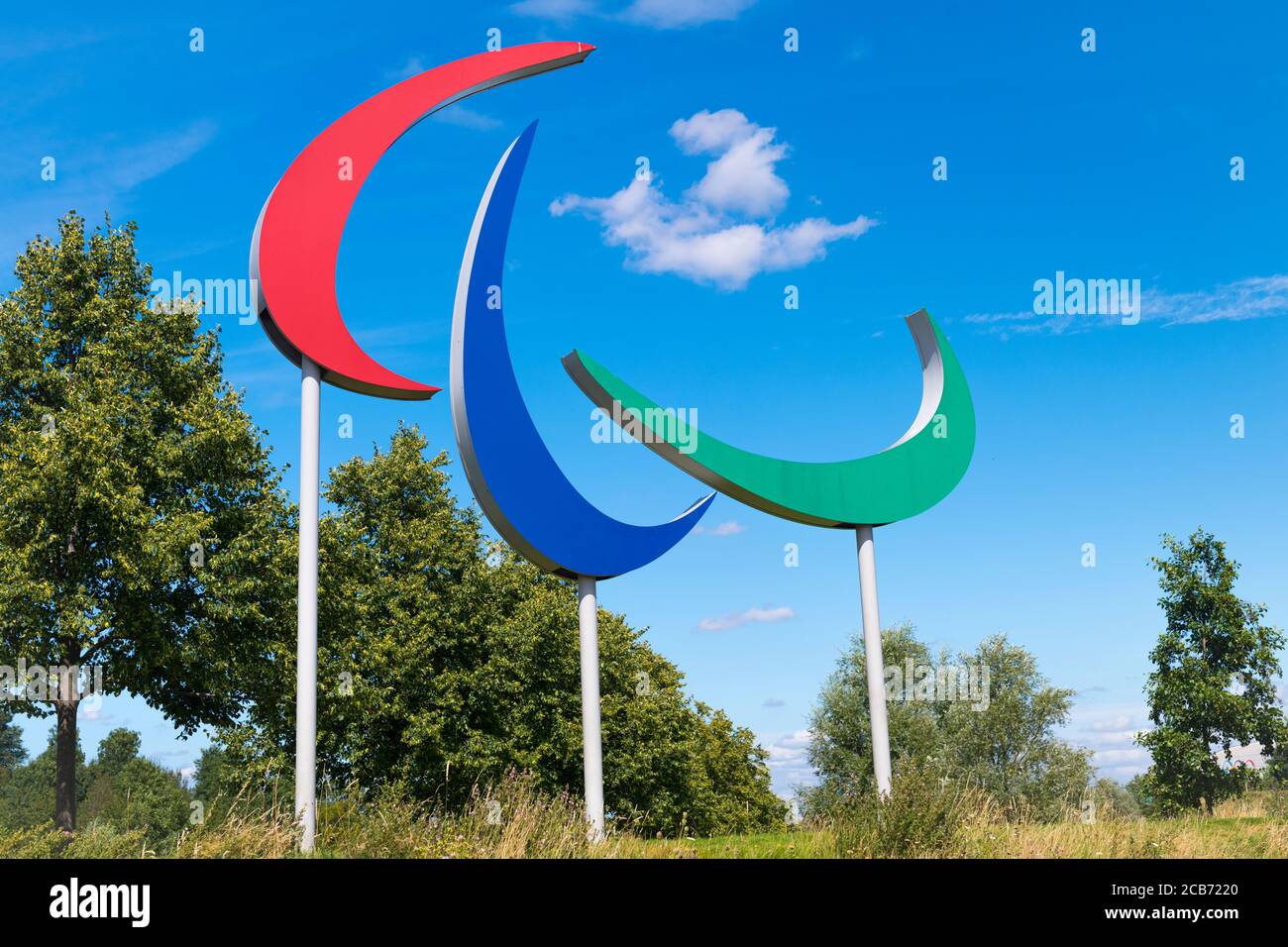 England London Stratford Hackney Wick Queen Elizabeth Park Paralympic logo sign red blue green Lee Valley blue sky clouds trees Stock Photo