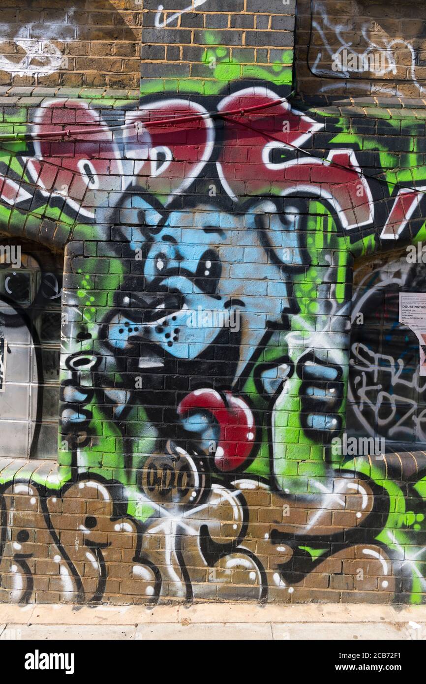 England London Stratford Park Hackney Wick graffiti happy looking blue dog puppy letters by 'Salo Koze?' Stock Photo