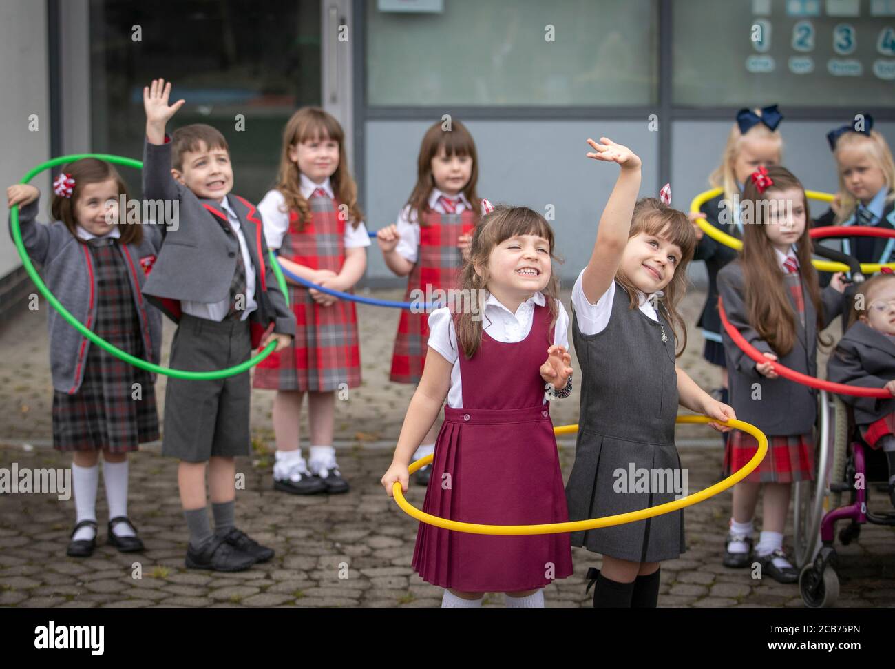 Malena and Lola Perez Malone with some of the other sets of twins from the Inverclyde area, pose for a photograph at Newark Primary in Port Glasgow, ahead of their first day at school. Stock Photo