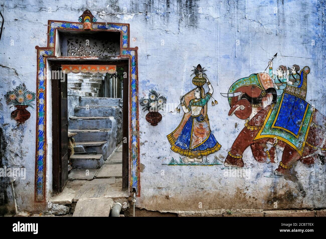 Traditional paintings on a wall in the old town of Bundi in Rajasthan, India. Stock Photo