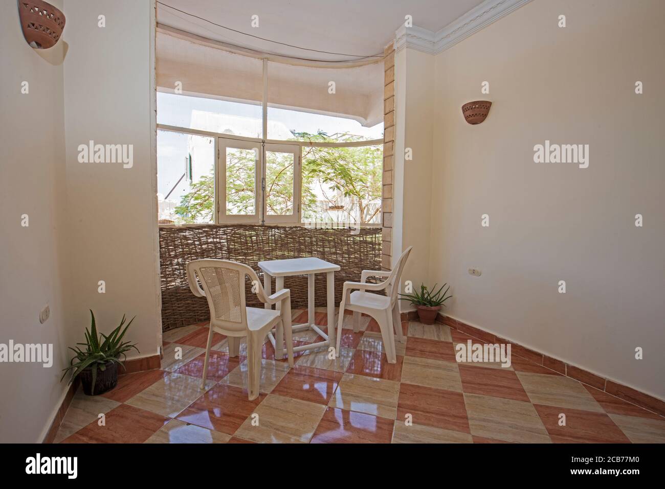 Balcony patio area in luxury apartment show home showing interior design conservatory decor furnishing Stock Photo