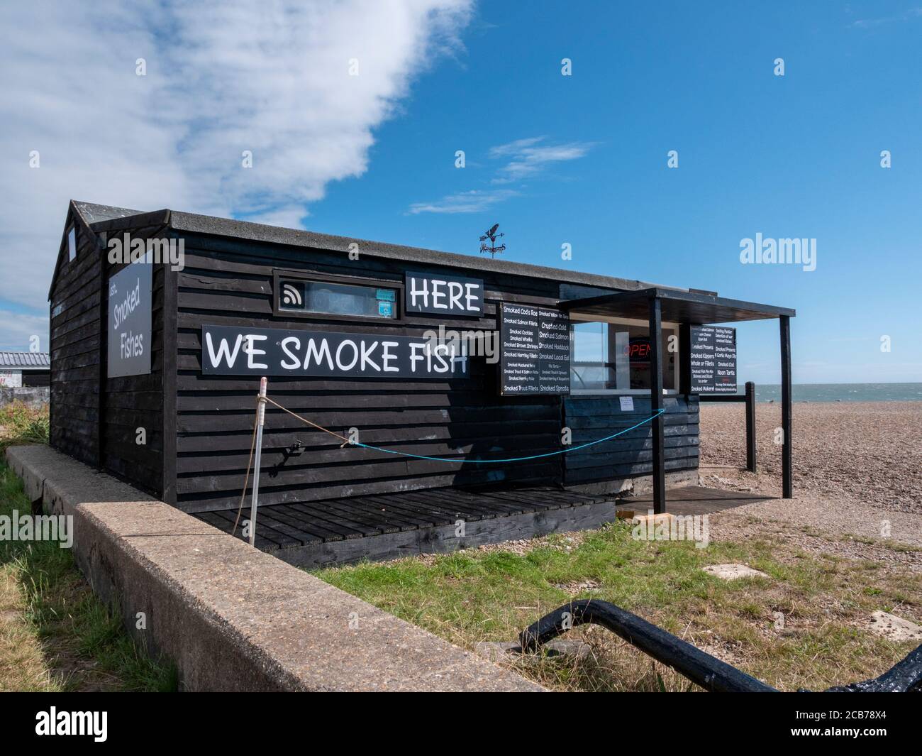 A fresh fish shop and smokery in a shed on the beach at Aldeburgh Suffolk UK Stock Photo