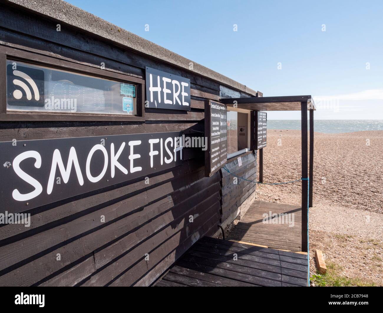 A fresh fish shop and smokery in a shed on the beach at Aldeburgh Suffolk UK Stock Photo