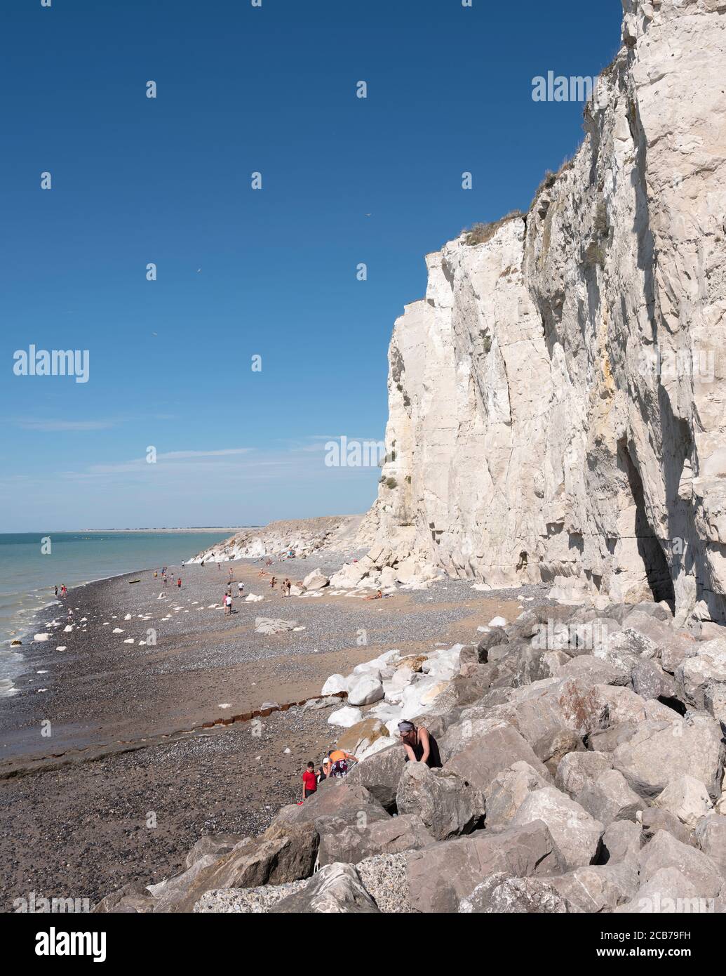 people on rocks and beach of ault in french normandy Stock Photo