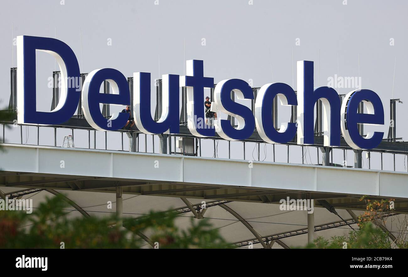 Workers install the letters for the new name of the football stadium, named after Germany's largest business bank, Deutsche Bank, in Frankfurt, Germany, August 11, 2020. REUTERS/Kai Pfaffenbach Stock Photo
