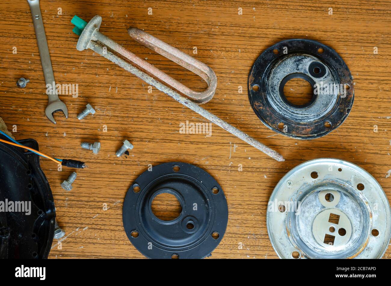 Details of a disassembled water heater. Anode, heating element