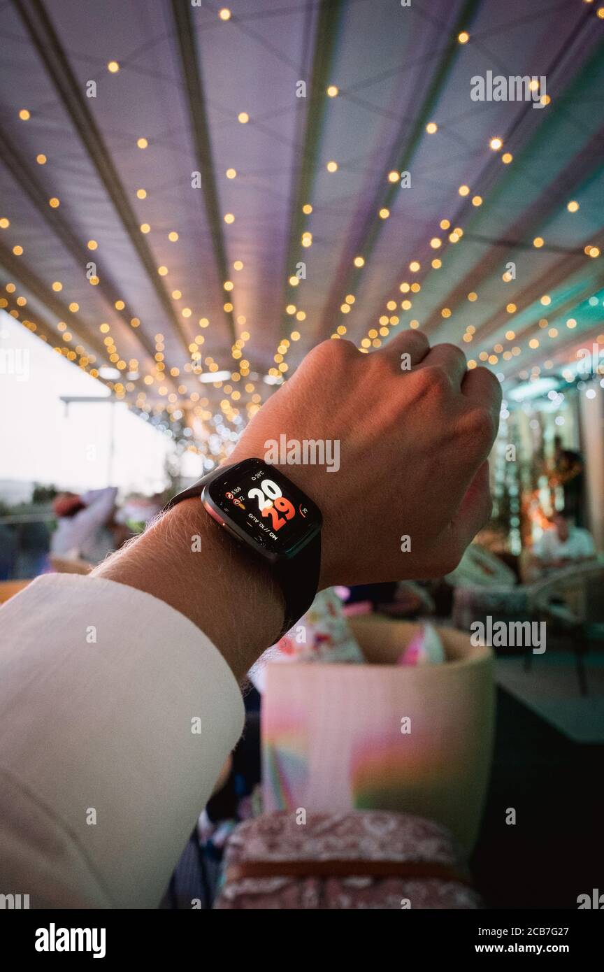 modern smart watch on a males hand with beautiful bokee Stock Photo