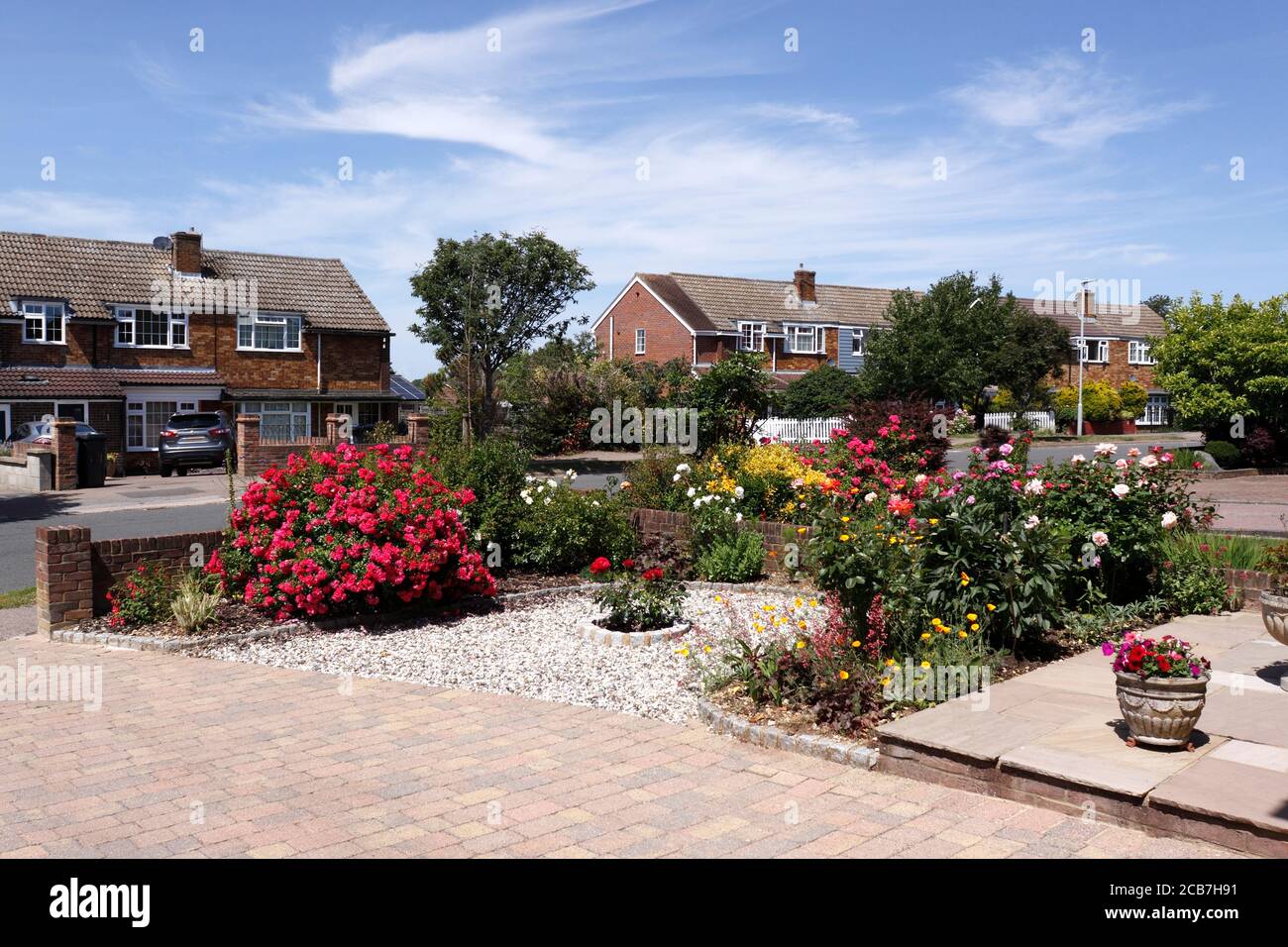 HOUSE WITH PRIVATE DRIVEWAY AND FRONT GARDEN OF DOMESTIC PROPERTY. UK