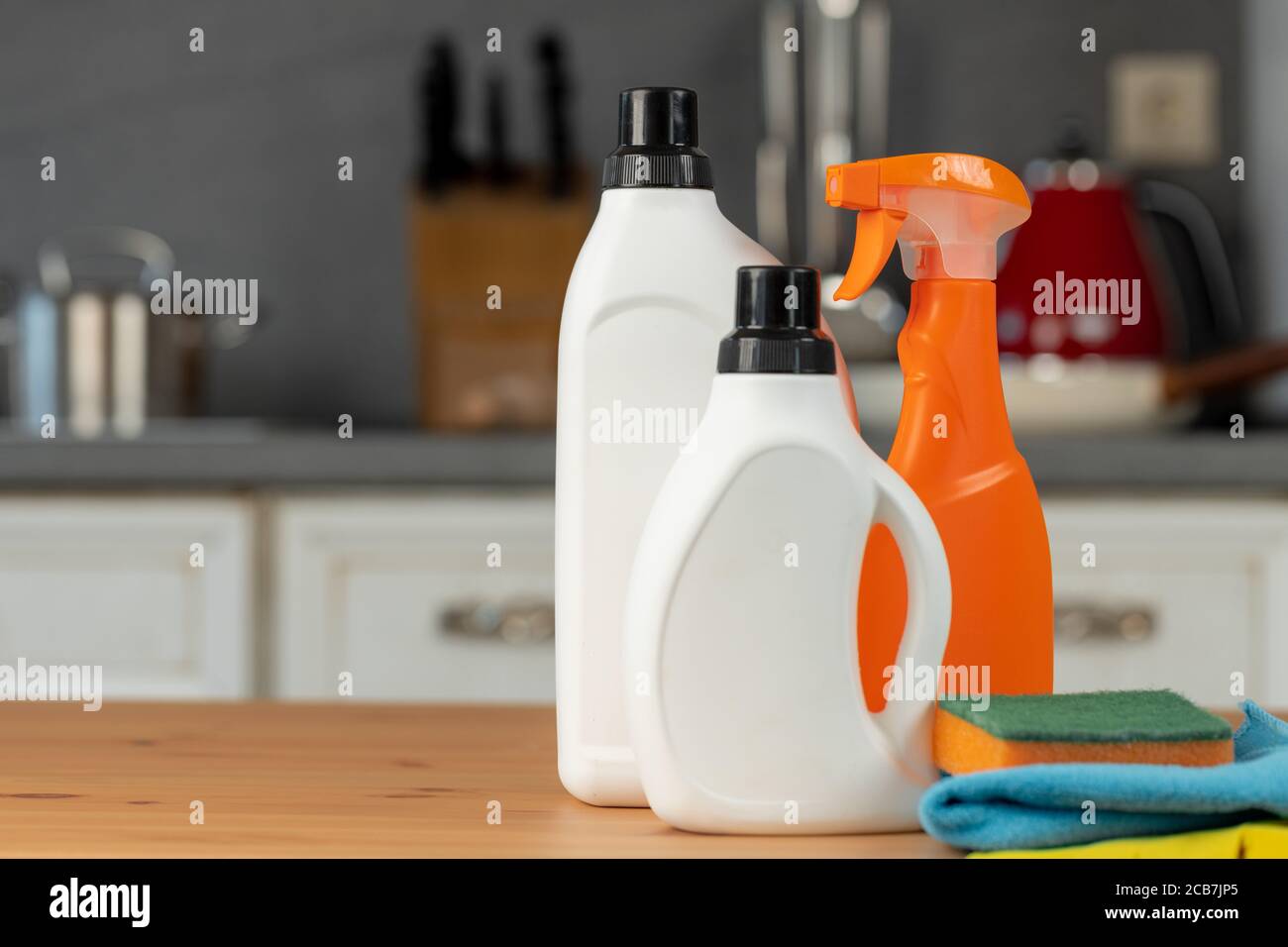 https://c8.alamy.com/comp/2CB7JP5/cleaning-detergents-and-tools-on-a-kitchen-counter-2CB7JP5.jpg