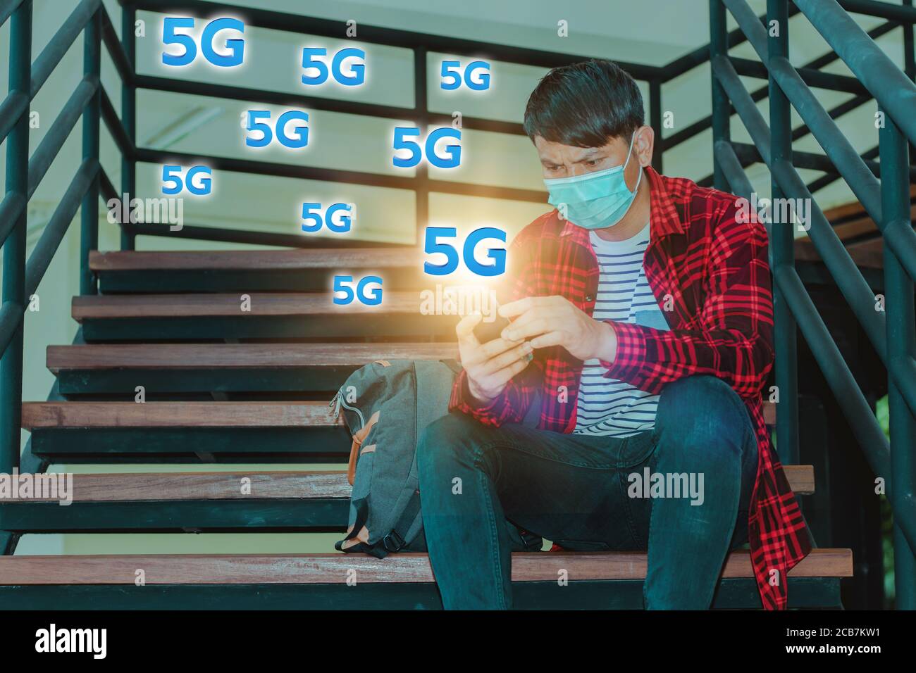 5G High speed internet network communication, man using mobile smartphone with 5G Stock Photo