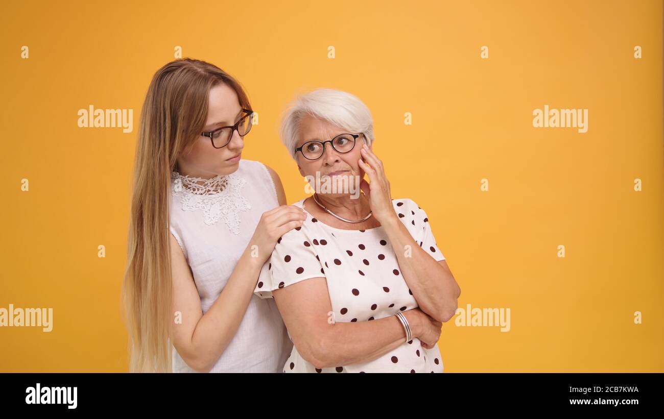 Young caucasian woman confronting senior lady after the bad news. High quality photo Stock Photo