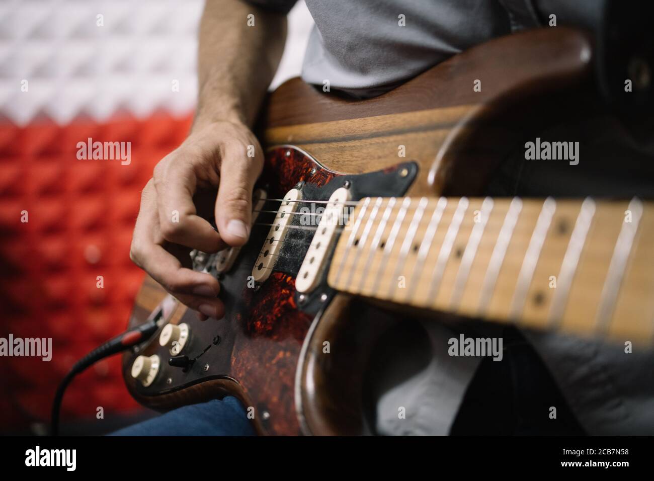 Hands Of Male Musician Playing Electric Guitar Close Up View Of Cropped Male Musician Playing Guitar In Soundproof Studio Stock Photo Alamy