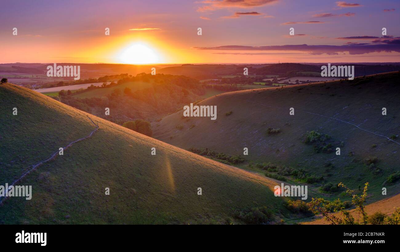 Clanfield, UK - July 28, 2020:  Summer sunset over the South Downs from Butser Hill near Petersfield, Hampshire, UK Stock Photo