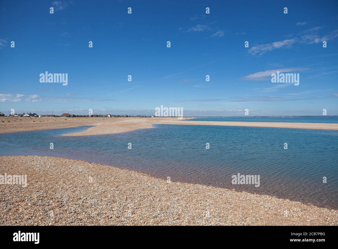 Pool of water on Dungeness beach; one of the largest shingle beaches in Europe Stock Photo Alamy