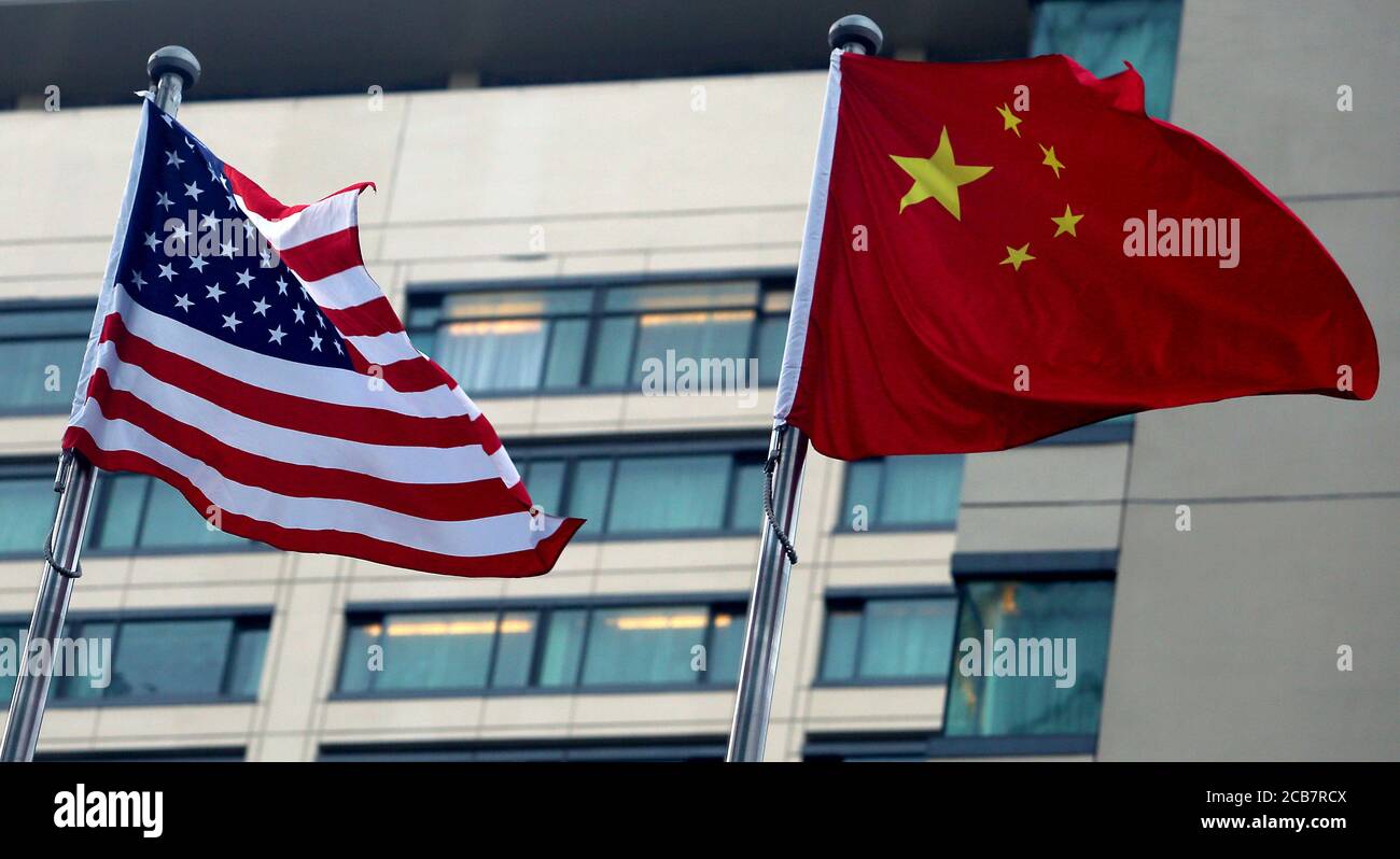 Beijing, China. 11th Aug, 2020. Both the American and Chinese national flags fly together outside an American hotel in downtown Beijing on Tuesday, August 11, 2020. Tensions between the U.S. and China continue to increase due to issues involving Hong Kong, Xinjiang, Huawei, Taiwan, Espionage and China's military expansion in the South China Sea. Photo by Stephen Shaver/UPI Credit: UPI/Alamy Live News Stock Photo
