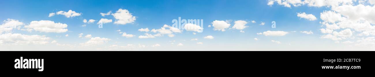 Summer sky background with warm and soft sunny tonings. Wide angle panorama for design works. Stock Photo