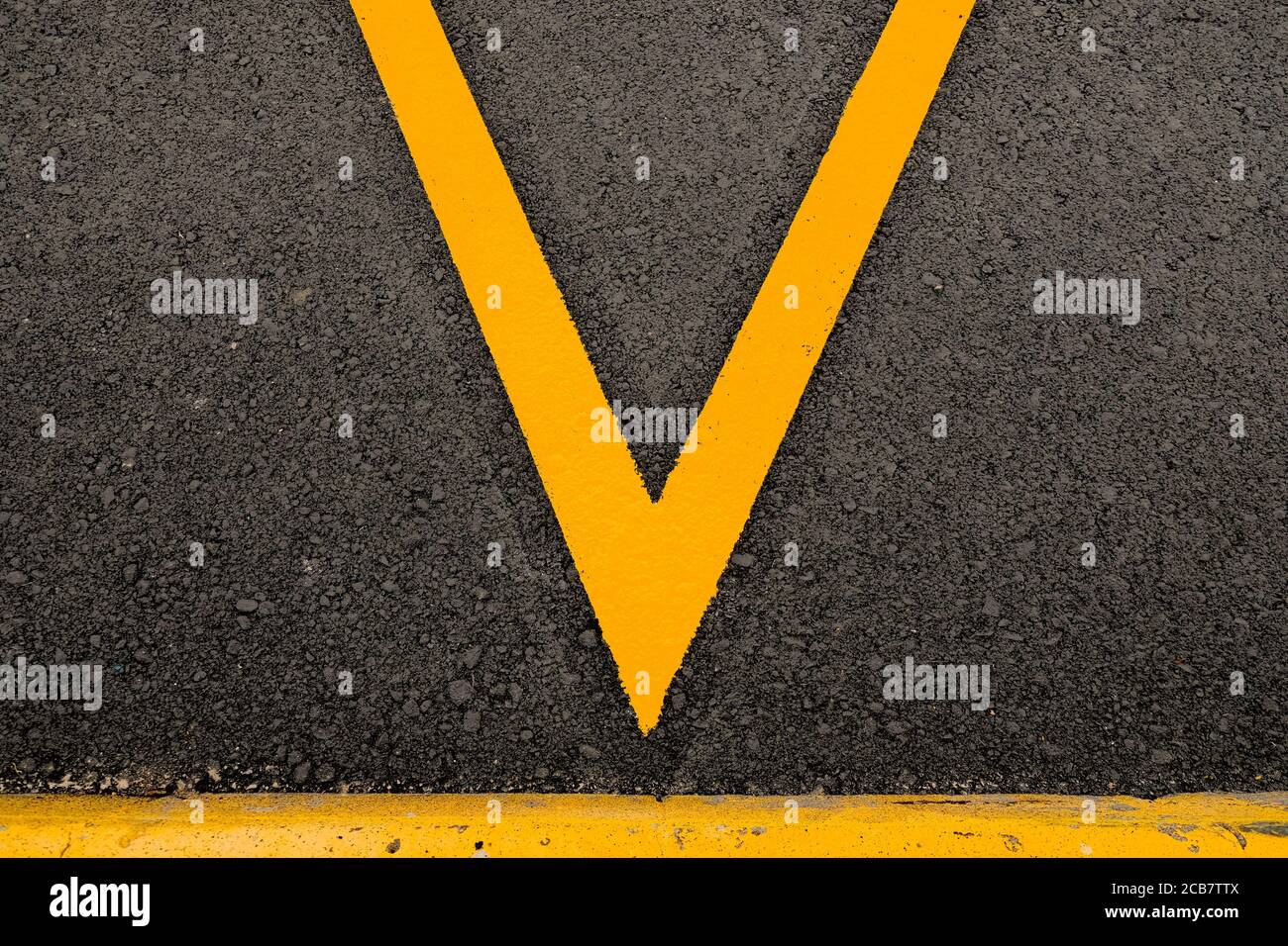 An abstract detail of parking lot marked in yellow reflective paint Stock Photo Alamy