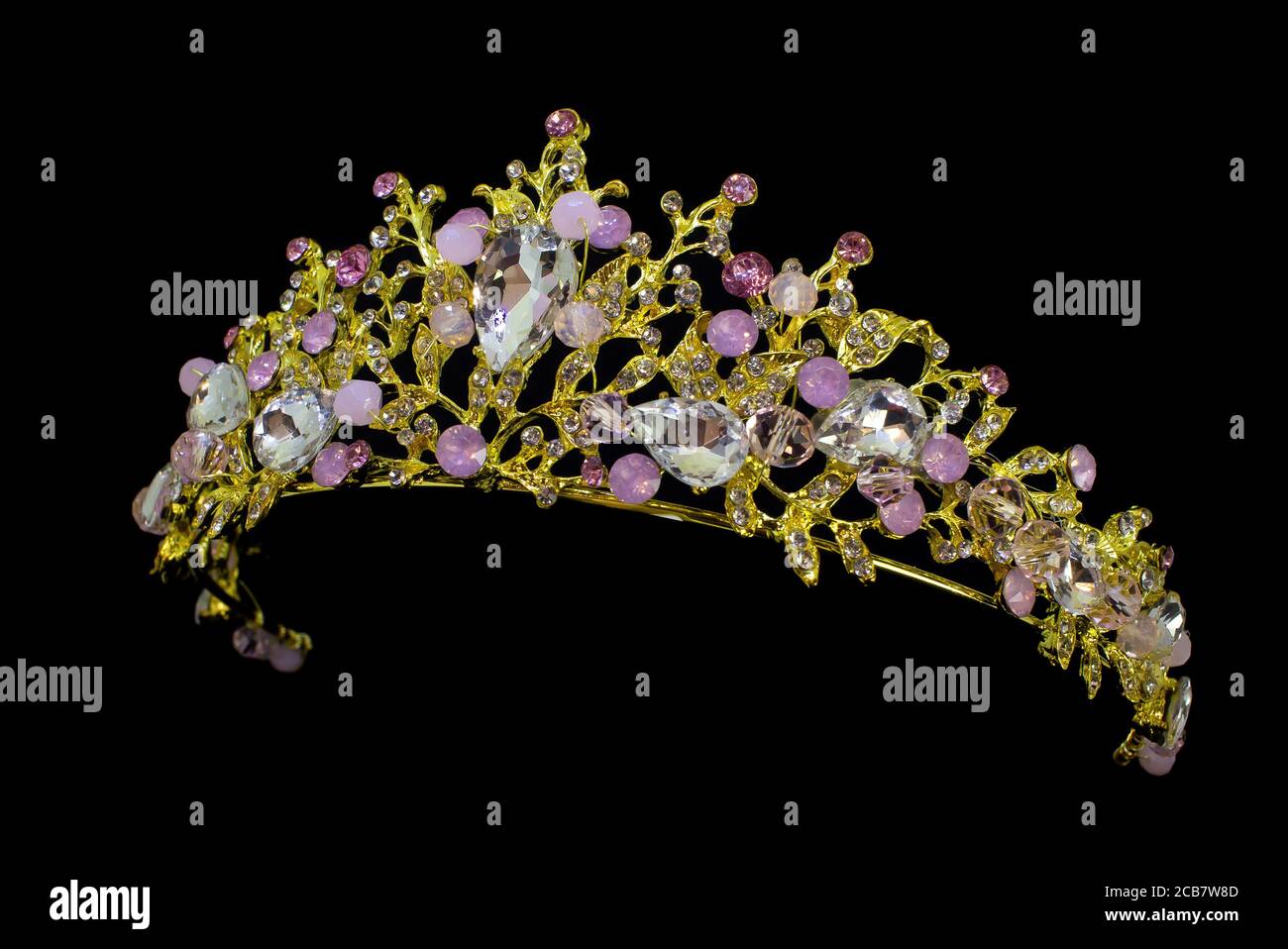 Jewellery gold crown tiara with diamonds and gemstones on black